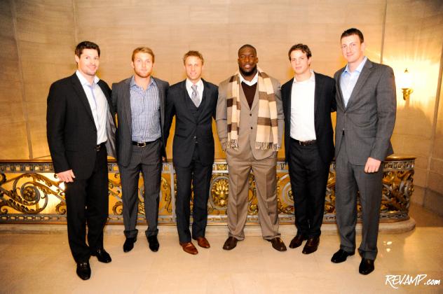 Eric Finn President Matt Landsberg stands surrounded by players from the Redskins and Capitals -- all decked out in the tailor's custom bespoke suits -- moments before they took to the runway for this year's 'Walk This Way' presentation.